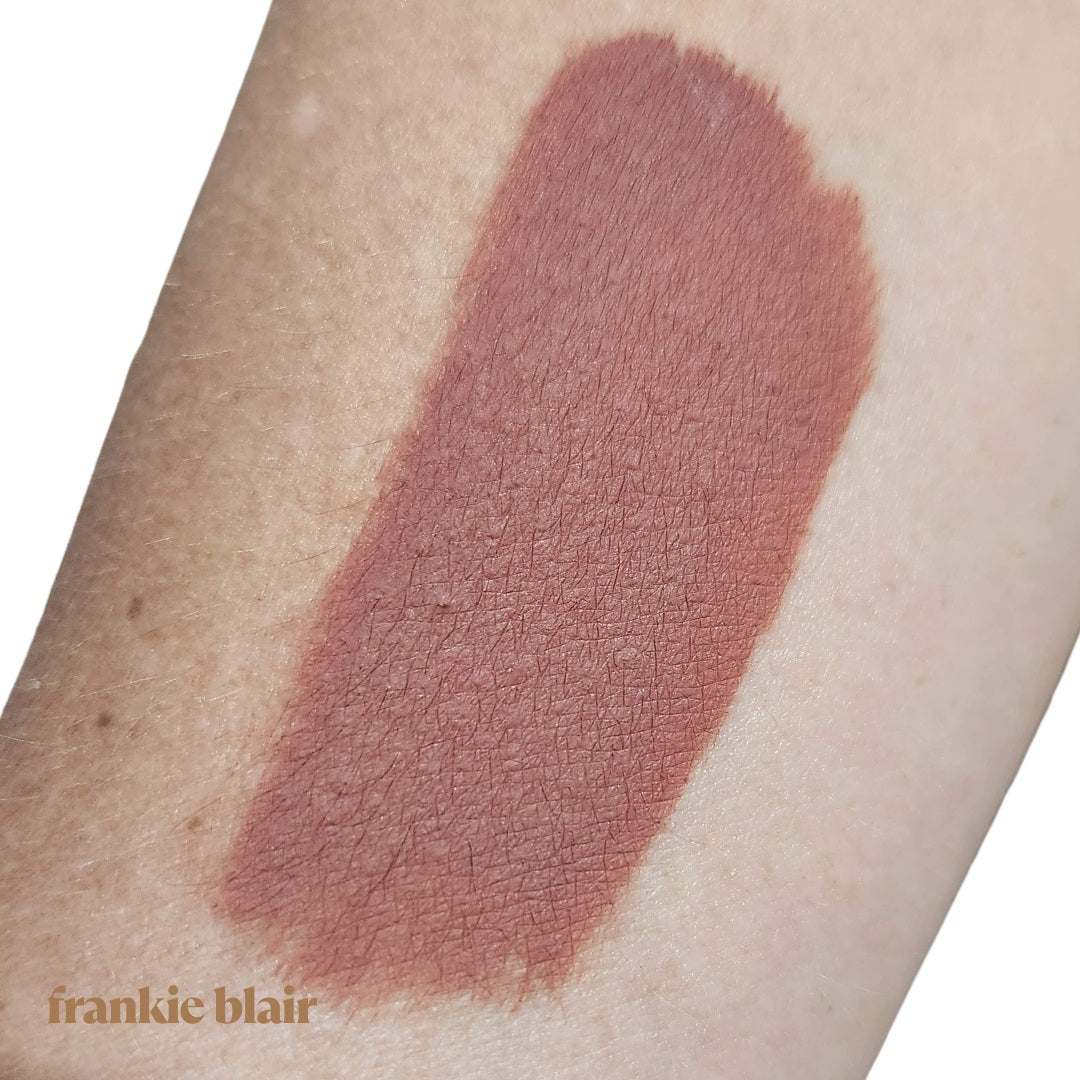 Frankie Blair O.G Frankie Matte Lip Stain Swatch on Arm, a modern 90s brown lip stain that is long lasting and hydrating.