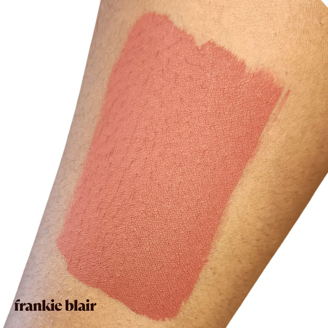 Frankie Blair Desert Rani Swatch on Arm,   A reddish brown lip stain that is long lasting and hydrating.