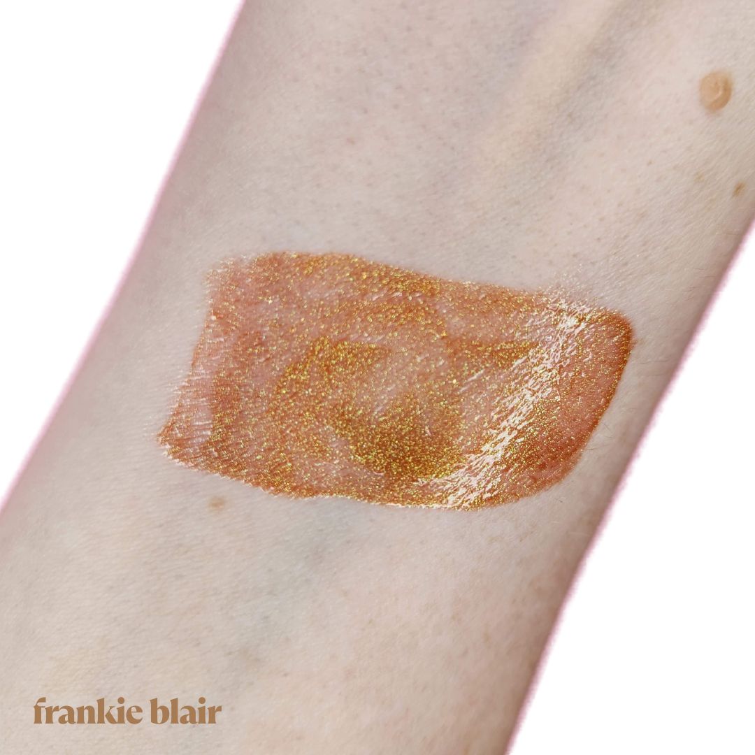 Frankie Blair Lip Gloss Raya a vibrant gold and pink gloss.